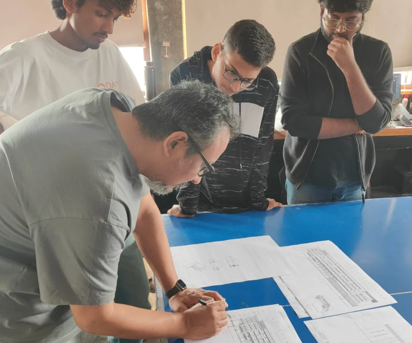 Studio team reviewing drawings